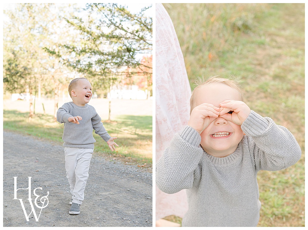 boy laughing while playing with his hands as mask taken by a family photographer