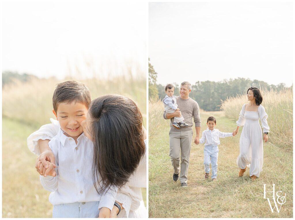 family of 4 walking in a field