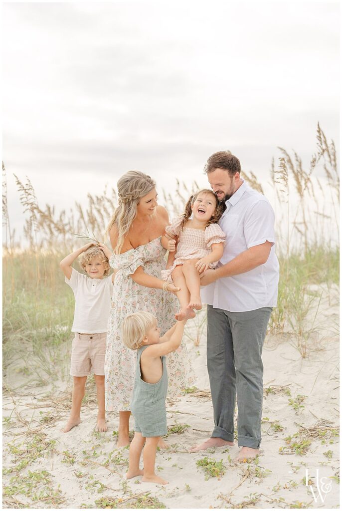 Family enjoying a beach portrait together