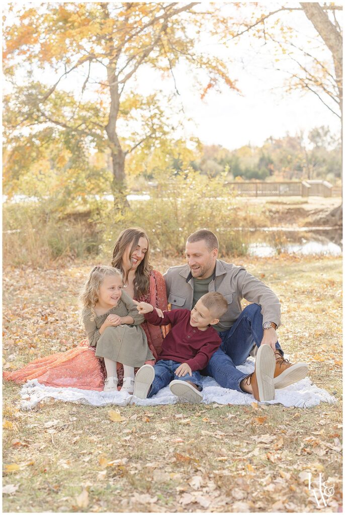 Family laughing together during an fall pictures