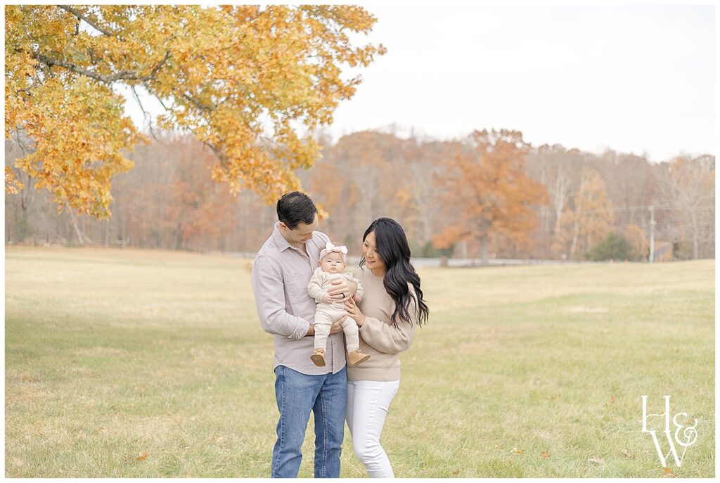 family of 3 posing during fall minis
